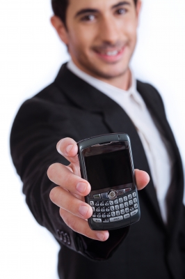 Man-Holding-Blackberry-Phone
