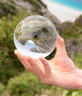 hand-holding-crystal-ball-in-nature