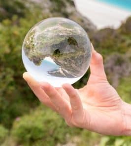 hand-holding-crystal-ball-in-nature