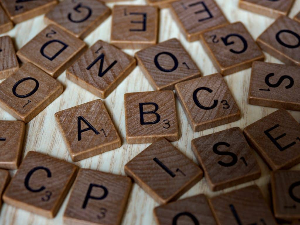 Scrabble Letters Scattered On Table