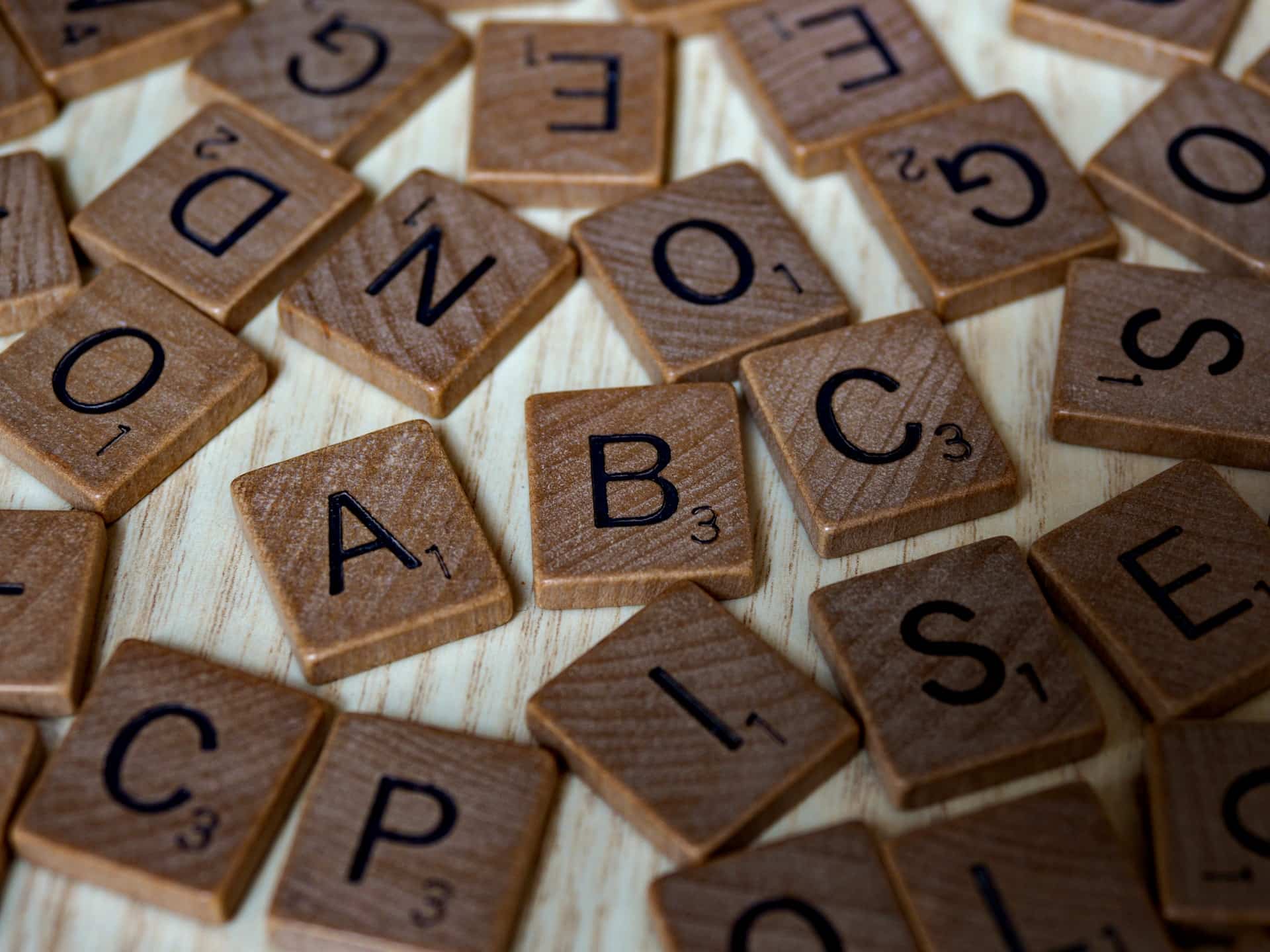 Scrabble letters scattered on table