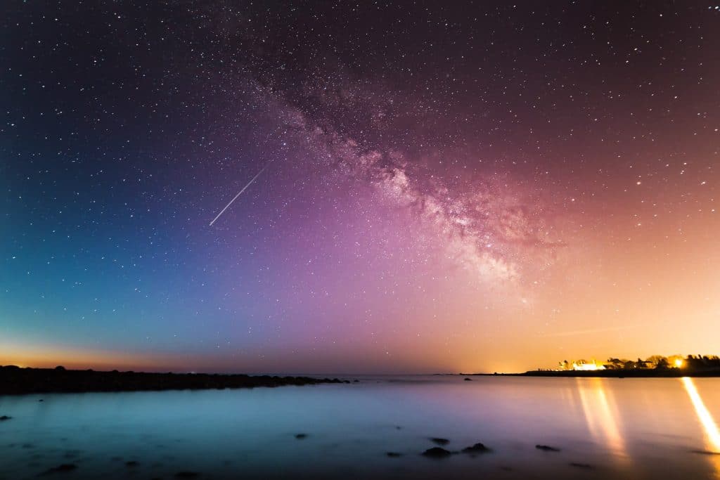 Stars In The Sky And Shooting Star Over Water