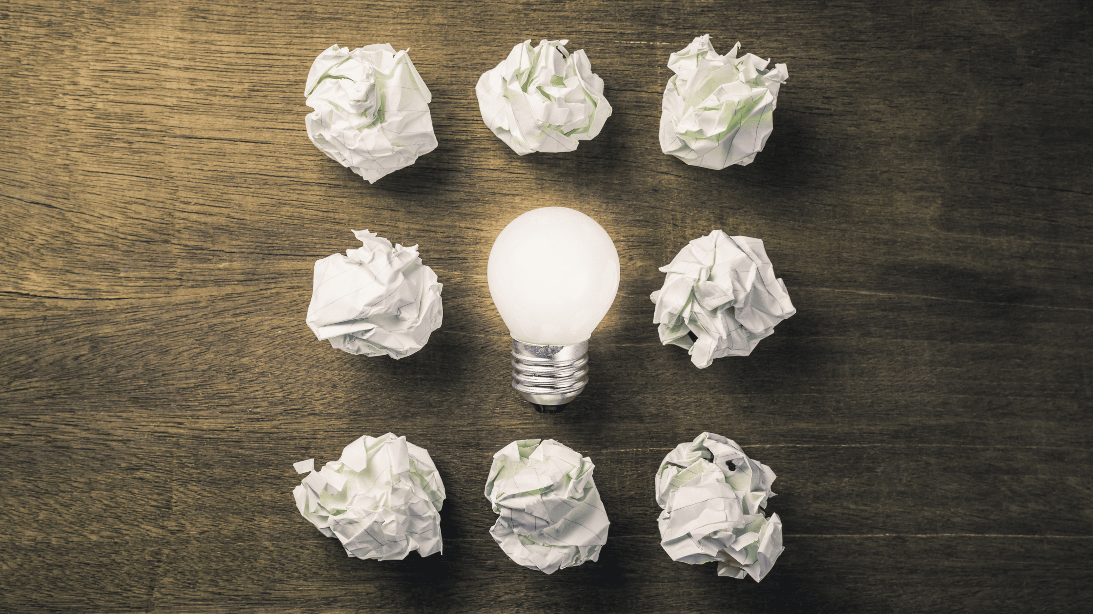 Glowing-Lightbulb-Among-Crumbling-Paper-Balls- Managing The Message