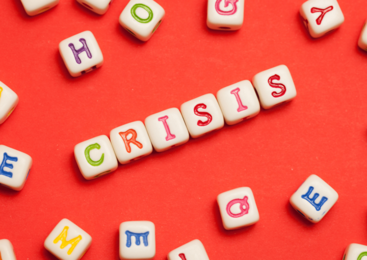 CRISIS spelled out in letters on a red background