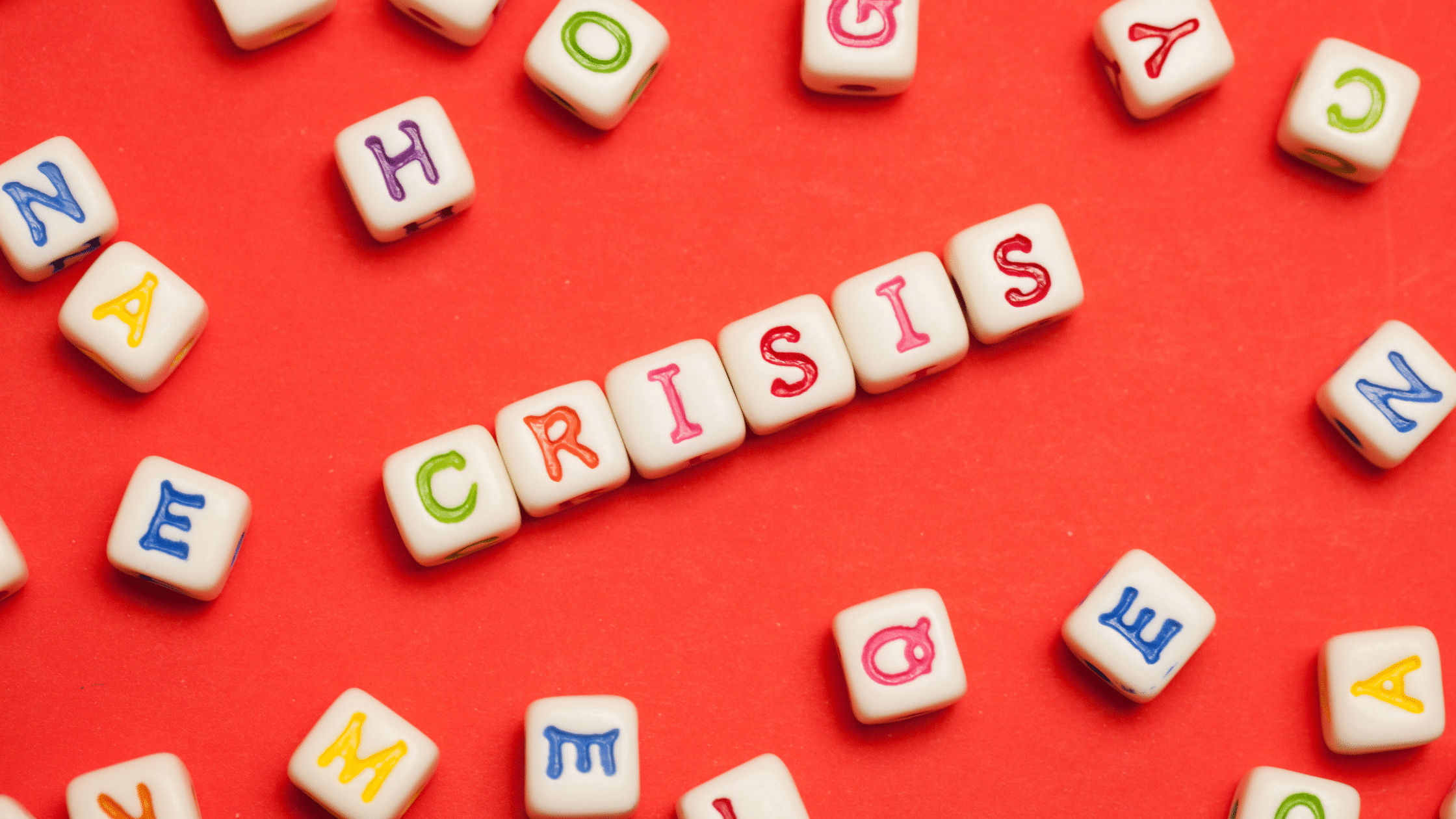 Crisis Spelled Out In Letters On A Red Background